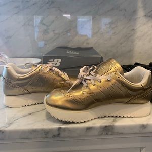 Gold new balance tennis shoes